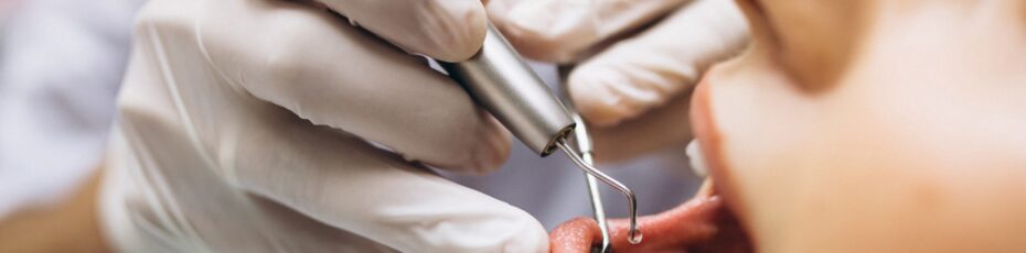 our dentist explaining about dental implants or dentures