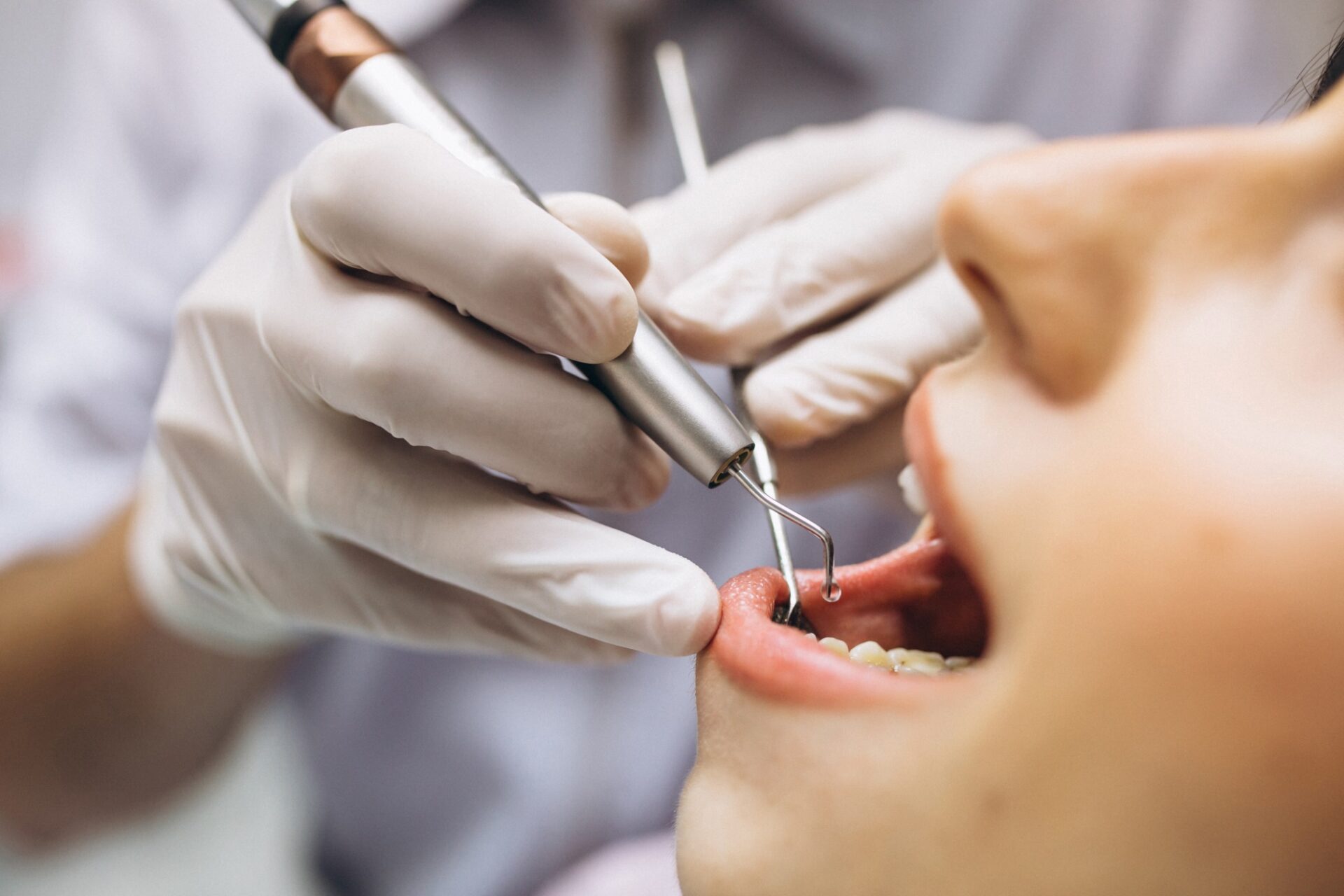 our dentist explaining about dental implants or dentures