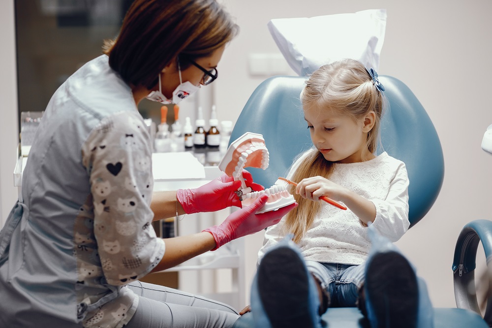 dentist explaining about child dental health