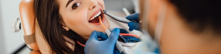 woman taking teeth cleaning treatment